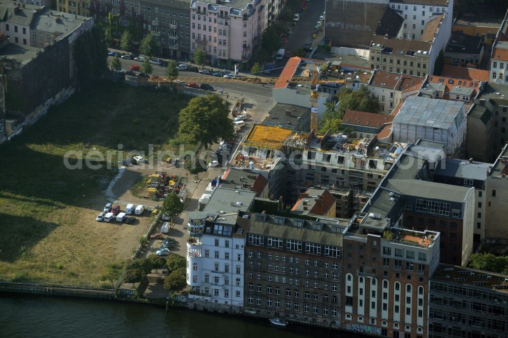 Berlin from the bird's eye view: Construction works on a residential block of historic buildings on Cuvrystrasse in the Wrangelkiez quarter of the Kreuzberg part of Berlin in Germany