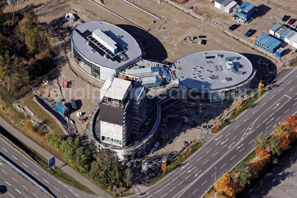 Aerial image Brunnthal - Construction site of the adventure center Jochen Schweizer Arena in Taufkirchen in the state of Bavaria. The adventure worlds include surfing, body flying - flying in the wind tunnel, climbing in the high ropes course and gastronomy. The layout of the joint project of the Jochen Schweizer Group and the Airbus Group is reminiscent of a propeller. Execution OSA Ochs Schmidhuber Architekten