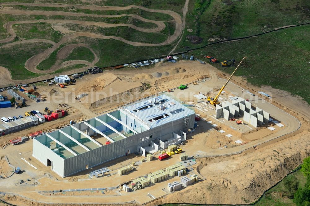 Schwerin from above - Construction works of a building of CVP in the Industrial Park Schwerin in Schwerin in the state of Mecklenburg - Western Pomerania. The newly developed industrial and commercial area is currently under construction in a forest area in the South of Schwerin. A building of CVP Clean Value Plastics is being developed on site