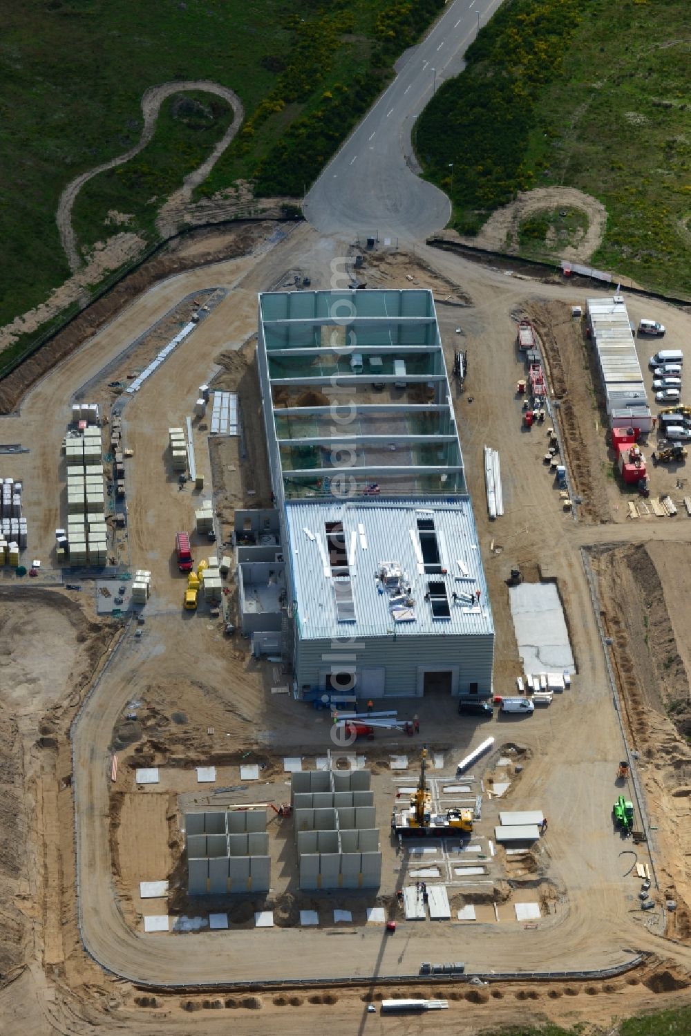 Aerial image Schwerin - Construction works of a building of CVP in the Industrial Park Schwerin in Schwerin in the state of Mecklenburg - Western Pomerania. The newly developed industrial and commercial area is currently under construction in a forest area in the South of Schwerin. A building of CVP Clean Value Plastics is being developed on site