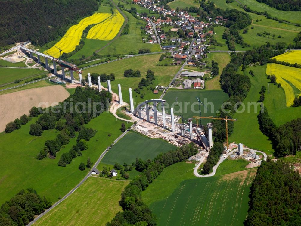 Aerial photograph Grümpen - Construction site at the Grümpentalbrücke in Southern Thuringia. The traffic and infrastructre project Deutsche Einheit (German Unity) No. 8 includes the construction of a new ICE track between the cities of Nürnberg, Erfurt and Leipzig. Owner is the Deutsche Bahn railway corporation. The bridge is will be the longest arch bridge of its kind in Europe. It is located south of the village of Grümpen. Adjacent construction work is being done for the new railway track