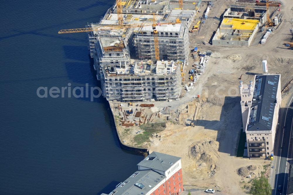 Potsdam from the bird's eye view: View of the construction works in the historic warehouse district in Potsdam. Condominia and tenements are going to develop