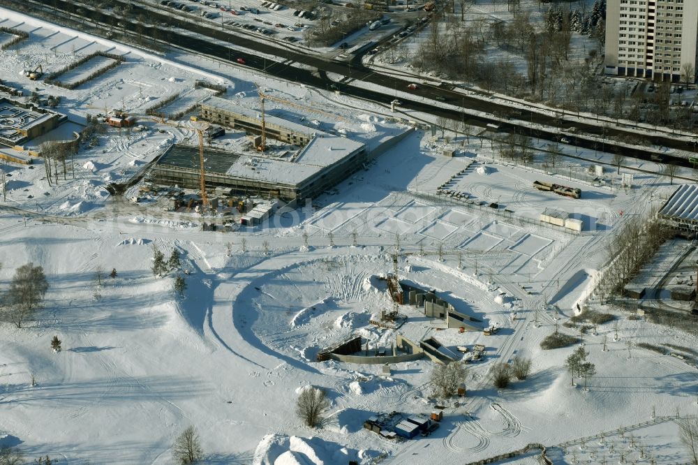 Berlin from the bird's eye view: Wintry snowy construction work for a new stage on site of the IGA 2017 in the district of Marzahn-Hellersdorf in Berlin. The heart of the International gerden exibition will be the Gaerten der Welt. The open air stage is being built near the main entrance on Blumberger Damm