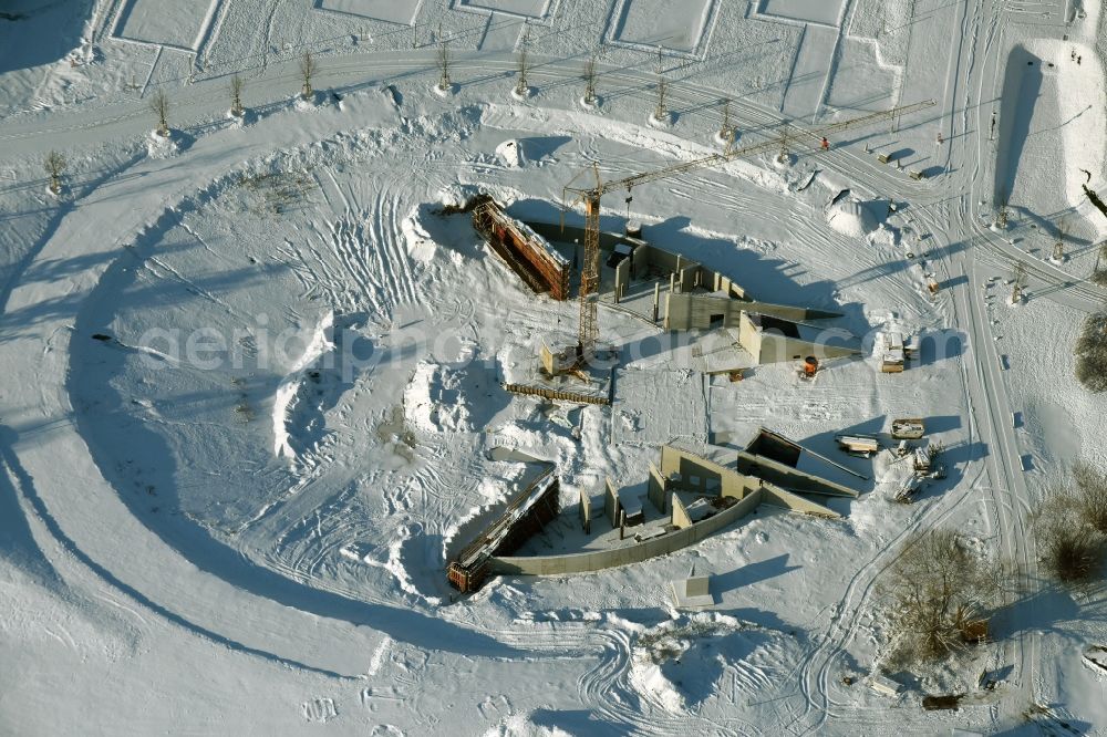 Aerial image Berlin - Wintry snowy construction work for a new stage on site of the IGA 2017 in the district of Marzahn-Hellersdorf in Berlin. The heart of the International gerden exibition will be the Gaerten der Welt. The open air stage is being built near the main entrance on Blumberger Damm