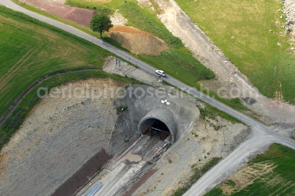 Aerial photograph Theuern - Blick auf die Bauarbeiten am Tunnel- Baumleite in Süd- Thüringen, einem Tunnelbau-Bauprojekt der ALPINE BeMo Tunnelling GmbH. Der Eisenbahntunnel entsteht im Rahmen des Verkehrsprojekt Deutsche Einheit (VDE) Nr. 8 innerhalb der ICE - Neubaustrecke Nürnberg–Erfurt–Leipzig der Deutschen Bahn. View of the construction of the tunnel Baumleite in southern Thuringia, a tunnel-construction project of the ALPINE Bemo Tunnelling Ltd.