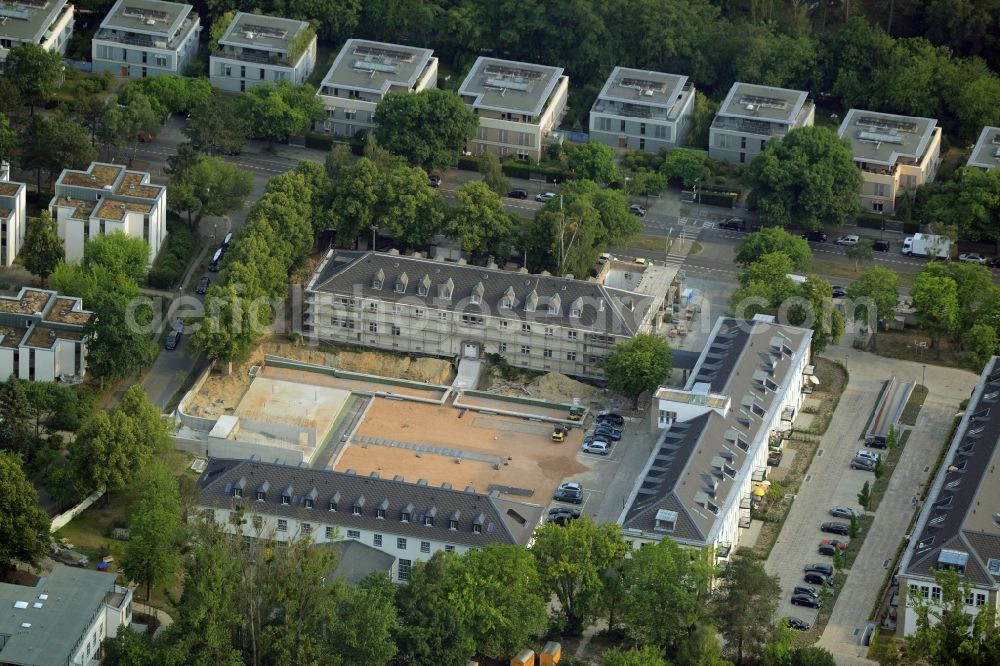 Aerial image Berlin - Construction works for a residential area on site of the former US-Army-Headquarters in the Zehlendorf part of Berlin in Germany. The former army and military base is being redeveloped and new apartments, flats and accommodations are being created. The military buildings are refurbished