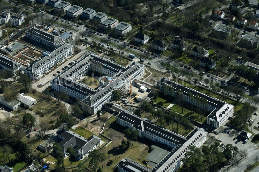 Aerial photograph Berlin - Construction works for a residential area on site of the former US-Army-Headquarters in the Zehlendorf part of Berlin in Germany. The former army and military base is being redeveloped and new apartments, flats and accommodations are being created. The military buildings are refurbished