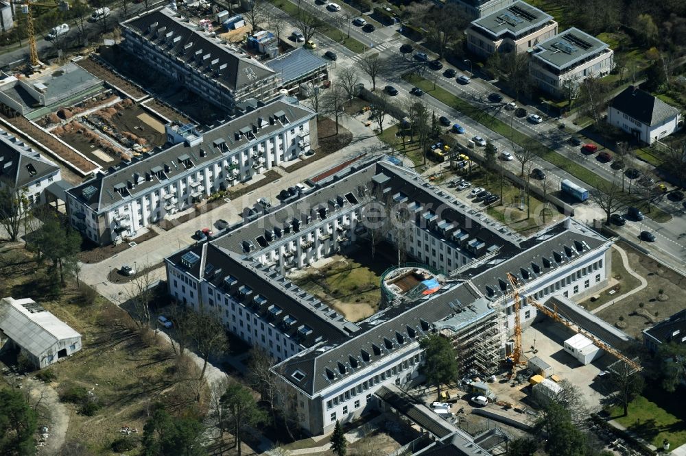 Berlin from above - Construction works for a residential area on site of the former US-Army-Headquarters in the Zehlendorf part of Berlin in Germany. The former army and military base is being redeveloped and new apartments, flats and accommodations are being created. The military buildings are refurbished