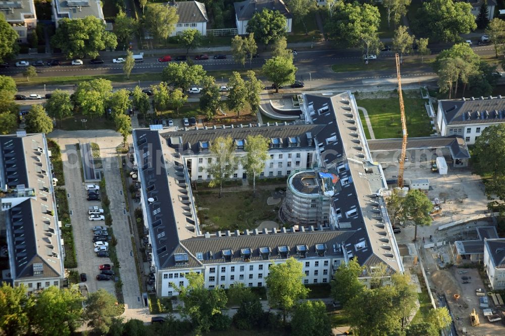 Berlin from above - Construction works for a residential area on site of the former US-Army-Headquarters in the Zehlendorf part of Berlin in Germany. The former army and military base is being redeveloped and new apartments, flats and accommodations are being created. The military buildings are refurbished