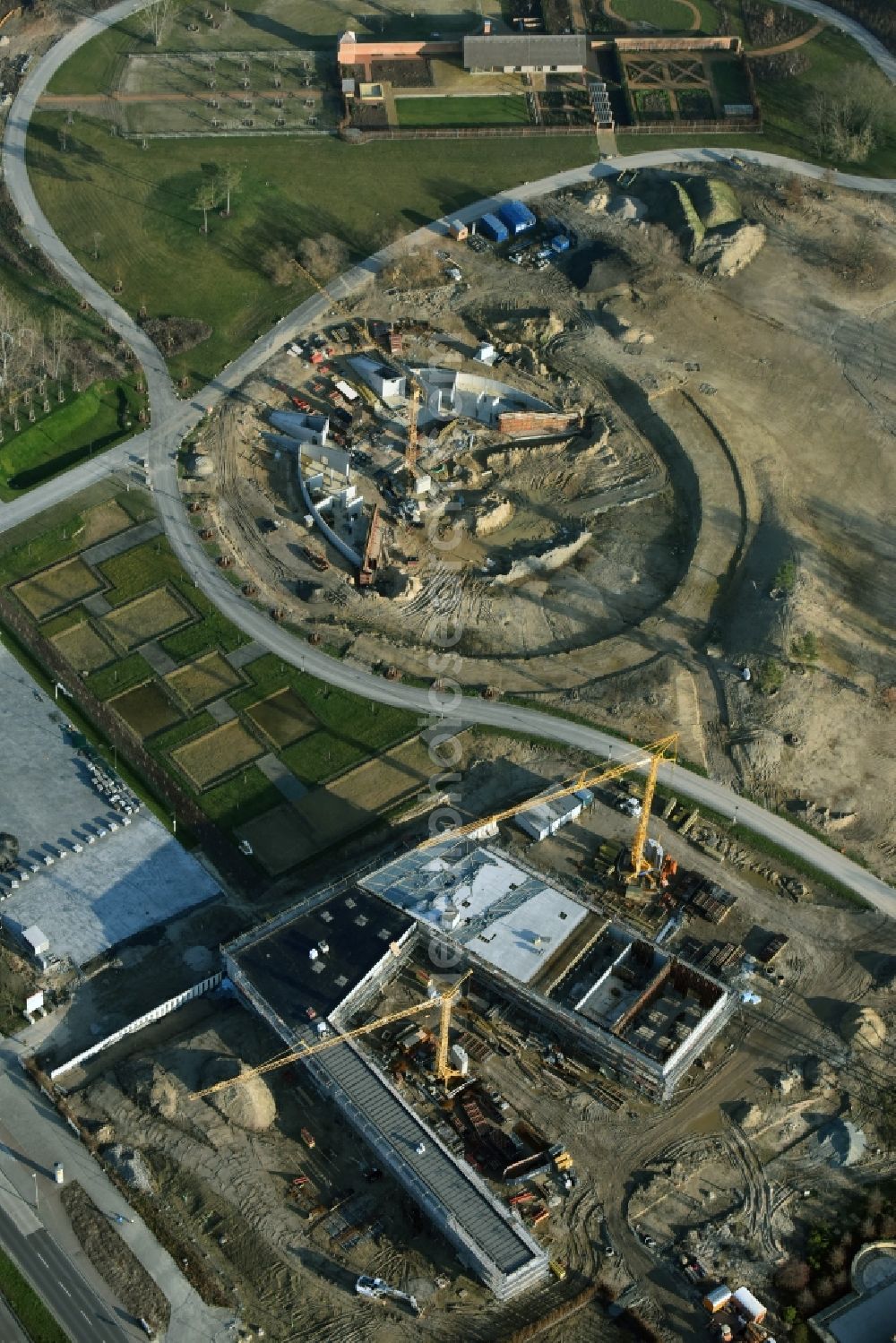 Berlin from the bird's eye view: Construction work for the visitor's centre at the main entrance of the IGA 2017 in the district of Marzahn-Hellersdorf in Berlin. The heart of the International gerden exibition will be the Gaerten der Welt. The visitor's centre is being built near the main entrance on Blumberger Damm