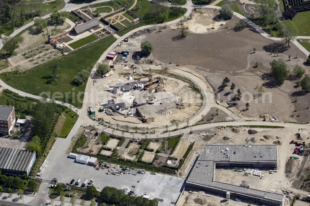 Berlin from the bird's eye view: Construction work for the visitor's centre at the main entrance of the IGA 2017 in the district of Marzahn-Hellersdorf in Berlin. The heart of the International garden exibition will be the Gaerten der Welt