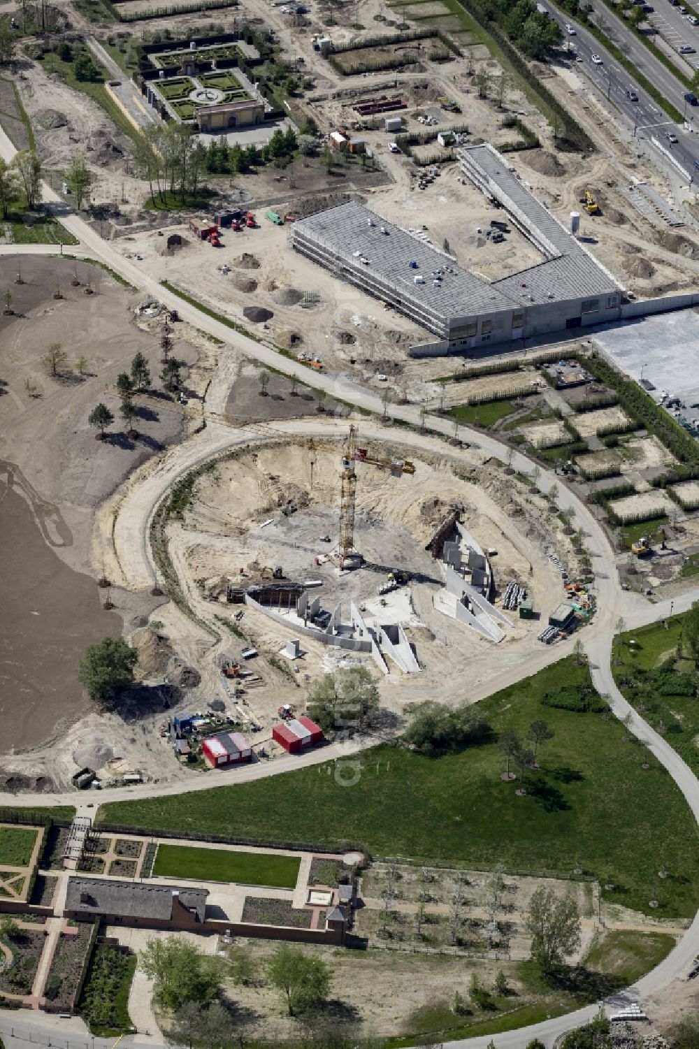 Berlin from above - Construction work for the visitor's centre at the main entrance of the IGA 2017 in the district of Marzahn-Hellersdorf in Berlin. The heart of the International garden exibition will be the Gaerten der Welt