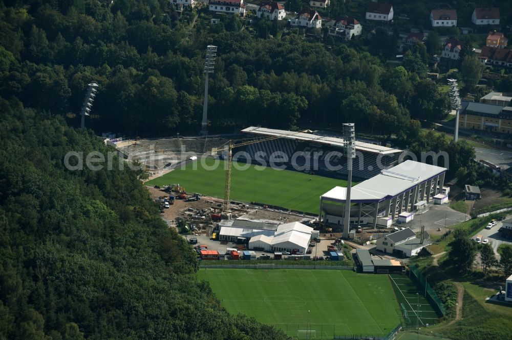 Aerial photograph Aue - Construction site to redevelop the football stadium Sparkassen-Erzgebirgsstadion of FC Erzgebirge Aue in Aue in the state of Saxony. Parts of the stadium are being demolished, refurbished and new stands are being built