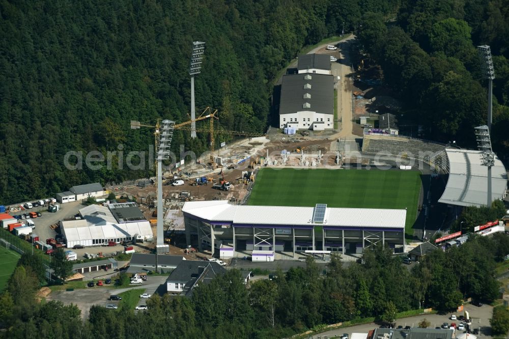 Aerial photograph Aue - Construction site to redevelop the football stadium Sparkassen-Erzgebirgsstadion of FC Erzgebirge Aue in Aue in the state of Saxony. Parts of the stadium are being demolished, refurbished and new stands are being built