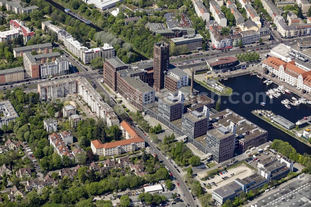 Aerial photograph Berlin - Historical monument and building Ullsteinhaus on the harbour of Tempelhof in Berlin, Germany. The building is known for its tower and used as a medical center, business building and arts and culture center