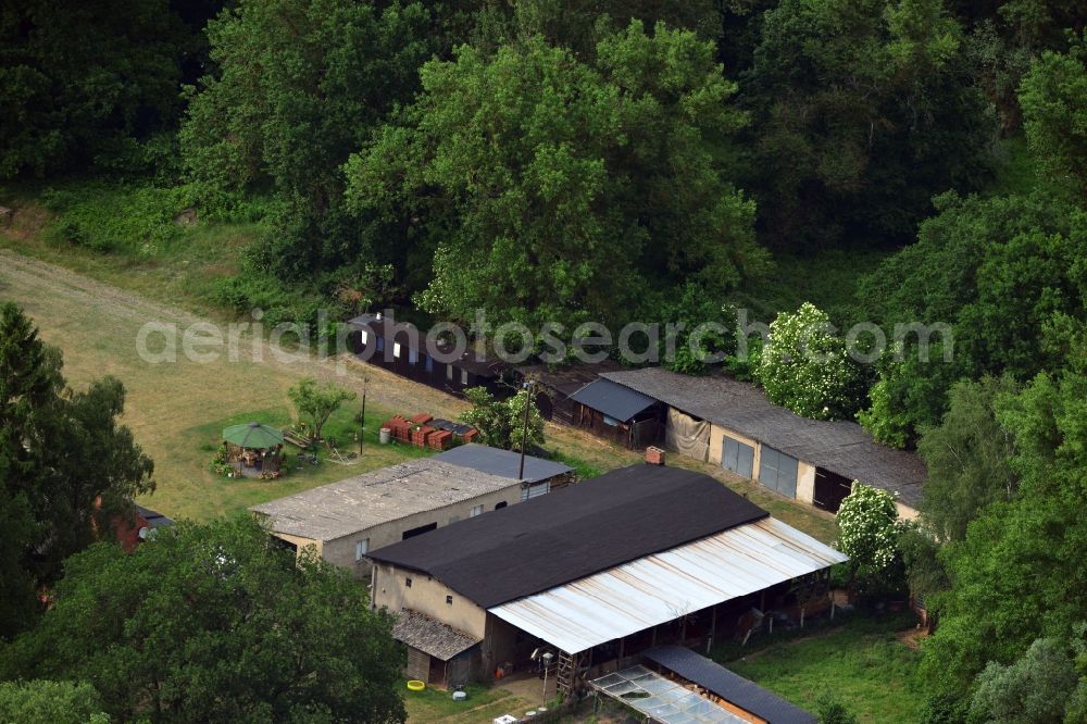 Wittenberge from the bird's eye view: Small farm outside of Wittenberge in the state Brandenburg. The site with its agricultural storage sheds is located at the street Dierowstückenweg