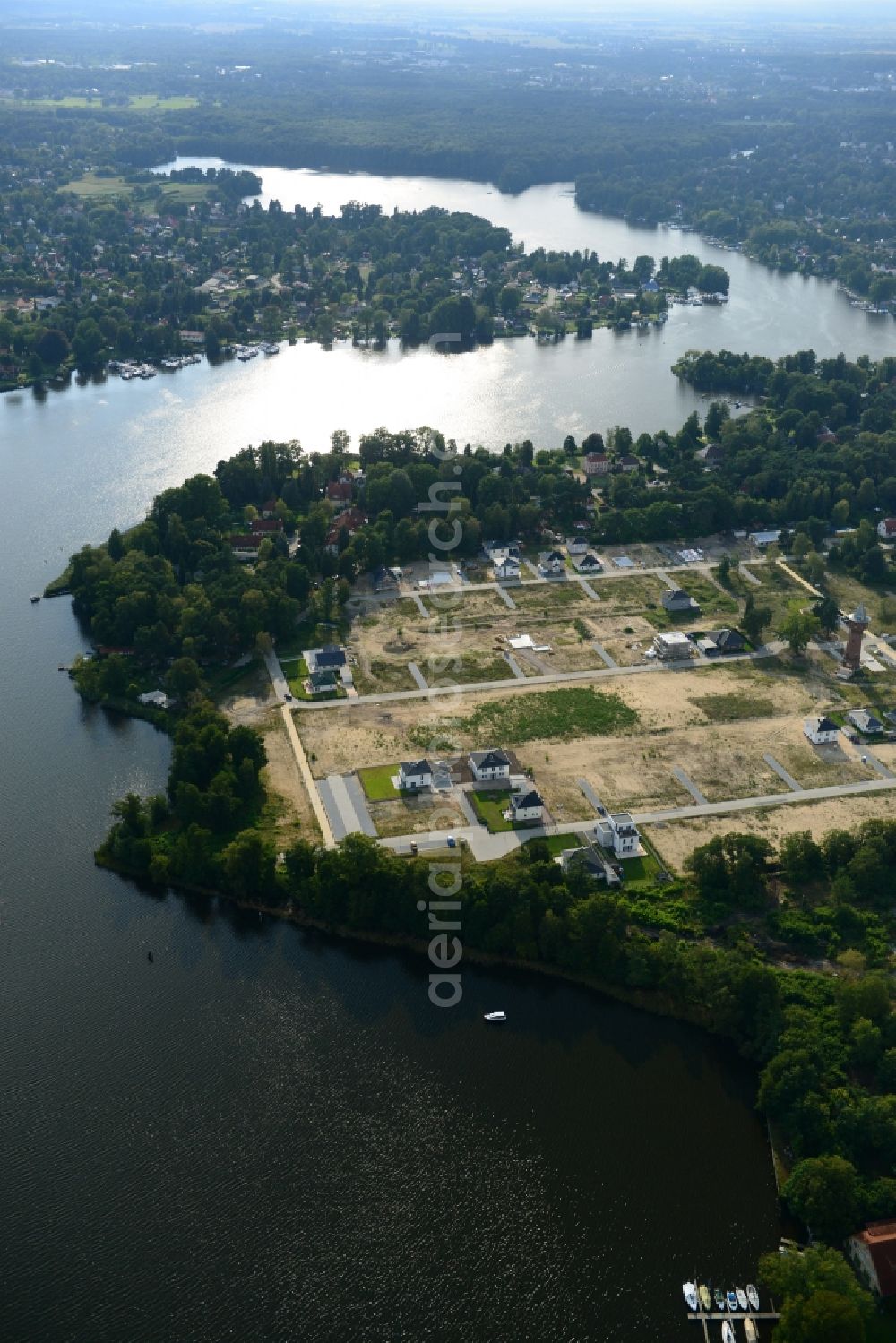 Königs Wusterhausen from the bird's eye view: Construction site of the future residential area Koenigsufer on the banks of Zernsee on Wustroweg in Koenigs Wusterhausen in Brandenburg