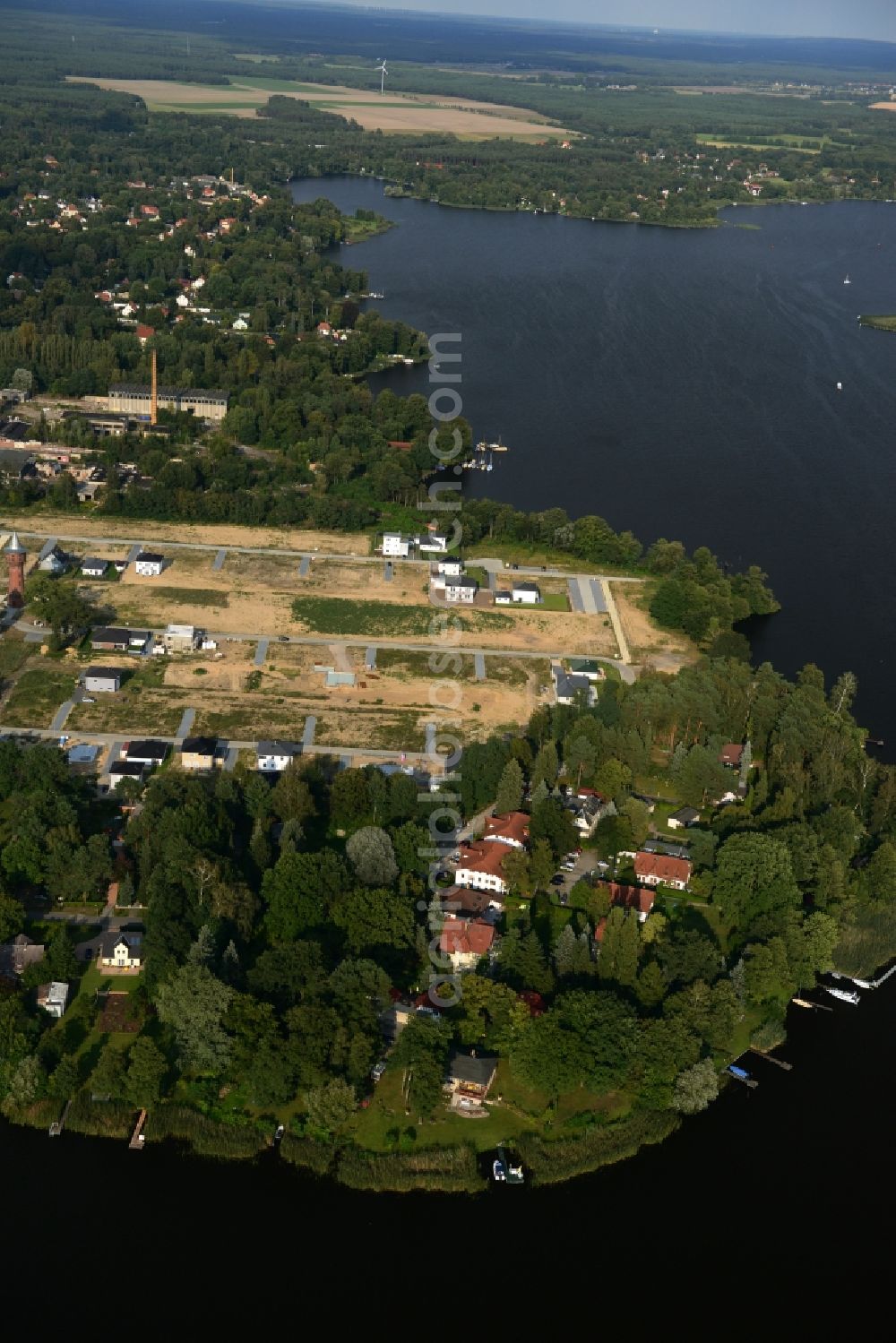 Königs Wusterhausen from the bird's eye view: Construction site of the future residential area Koenigsufer on the banks of Zernsee on Wustroweg in Koenigs Wusterhausen in Brandenburg