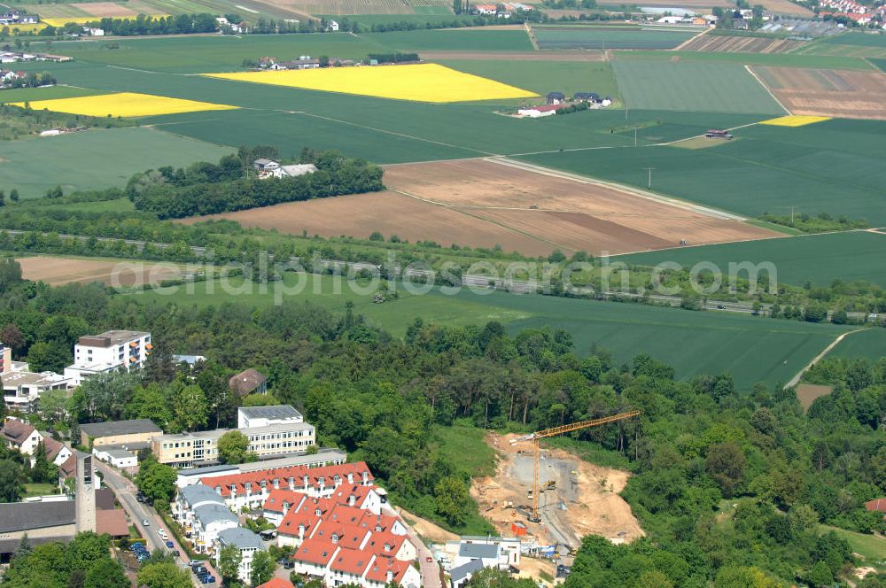 Aerial image Bad Vilbel - Blick die Baustelle der Wohnanlage am Tannenweg der cds Wohnbau GmbH. In Waldrandlage entstehen hier mehrere Wohnneubauten durch die cds Wohnbau GmbH, einem Frankfurter Immobiliendienstleister. View the construction site of new development on Tannenweg. At the forest are several new residential buildings caused by the CDS Wohnbau GmbH, a Frankfurt real estate service providers.