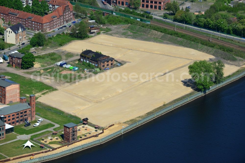 Wittenberge from the bird's eye view: Building areas and building land - development work in the area of ??development of the port city of Wittenberg in Brandenburg