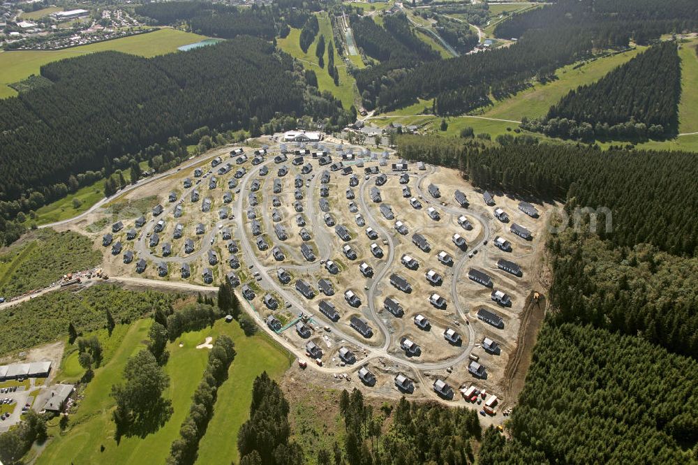 Winterberg from the bird's eye view: Baugebiet vom noch nicht fertiggestellten Landal Ferienpark in der Winterberger Büre in Winterberg, Nordrhein-Westfalen. Building area of the, yet not completely ready-made, Landal holiday park in Winterberg, North Rine-Westphalia.