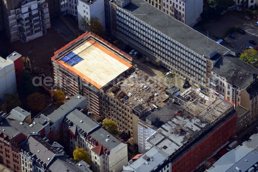 Aerial image Leipzig - View of the construction work at the former Ring-Messehaus at Trodlinring in Leipzig in Saxony. The formerly largest urban exhibition hall in the world was left vacant since 1994. In 2013 the connecting part between the two end buildings were torn down. A hotel by the company Travel24.com AG will be developed at this site