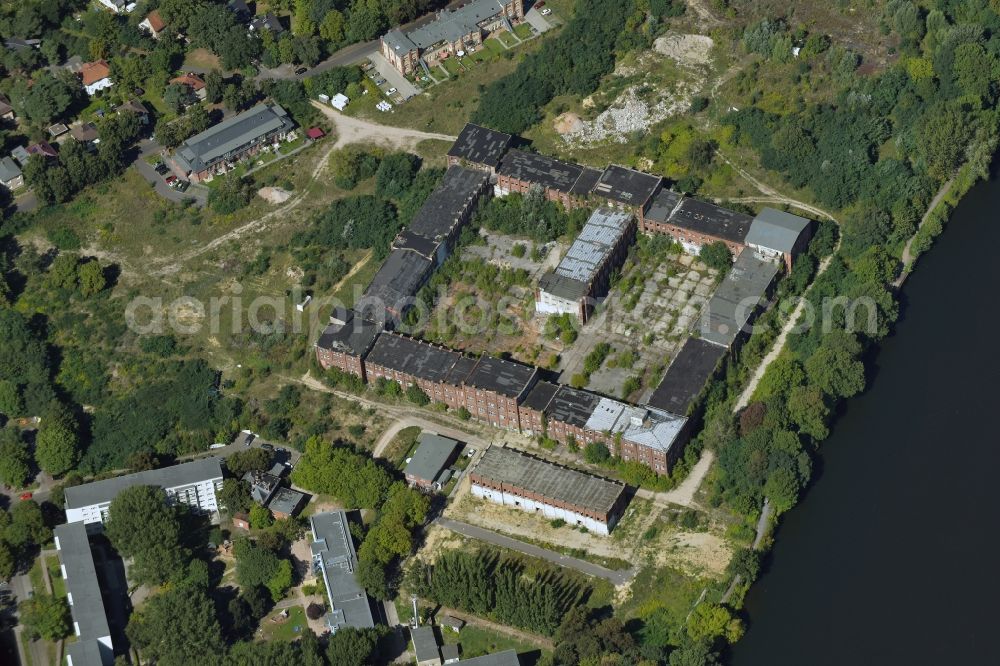 Berlin from the bird's eye view: Reconstruction and expansion - construction site of the buildings and halls of the old REWATEX laundry in the district of Spindlersfeld in Berlin, Germany. The Kanton Property development company mbH is building new apartments on the site with the Wasserstadt Spindlersfeld on the listed area