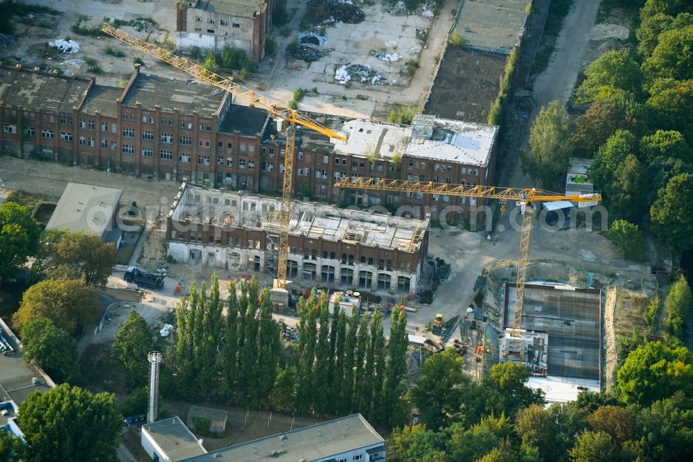 Aerial image Berlin - Reconstruction and expansion - construction site of the buildings and halls of the old REWATEX laundry in the district of Spindlersfeld in Berlin, Germany. The Kanton Property development company mbH is building new apartments on the site with the Wasserstadt Spindlersfeld on the listed area