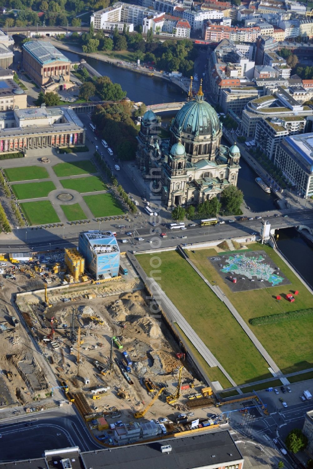 Berlin from above - View at the ground preparation for the planned Berlin castle - Humboldt Forum on the grounds of the former city castle in the district Mitte in Berlin. Executing enterprise is the company Bilfinger Berger SE