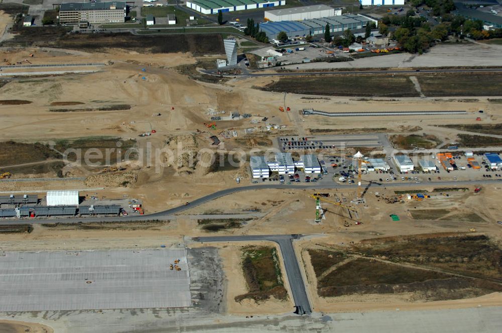 Schönefeld from the bird's eye view: Blick auf Baulogistik- Bereiche am Neubaufeld zum Flughafen Berlin-Schönefeld BBI (SXF) Ausführende Firmen: Hochtief AG; EUROVIA Beton; PORR; BERGER Bau; Kark Weiss; Matthai; Schäler Bau Berlin GmbH; STRABAG; MAX BÖGL