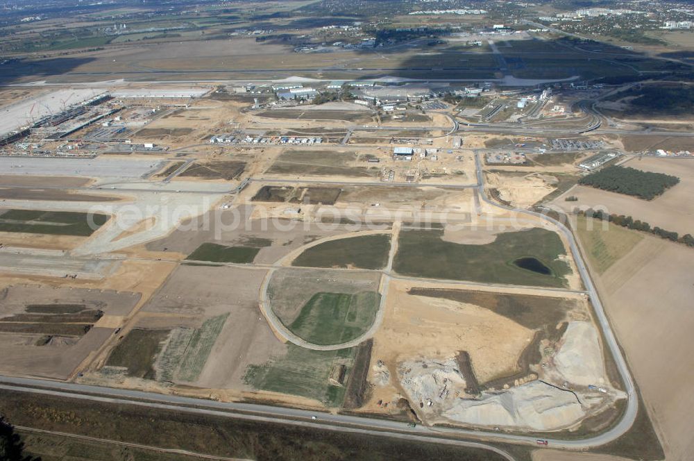 Schönefeld from the bird's eye view: Blick auf Baulogistik- Bereiche am Neubaufeld zum Flughafen Berlin-Schönefeld BBI (SXF) Ausführende Firmen: Hochtief AG; EUROVIA Beton; PORR; BERGER Bau; Kark Weiss; Matthai; Schäler Bau Berlin GmbH; STRABAG; MAX BÖGL