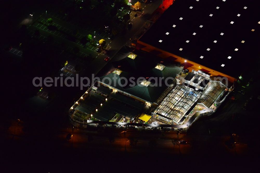 Aerial image Berlin - Night image with a view over the Hornbach construction market at the street Maerkische Spitze in the district Marzahn in Berlin