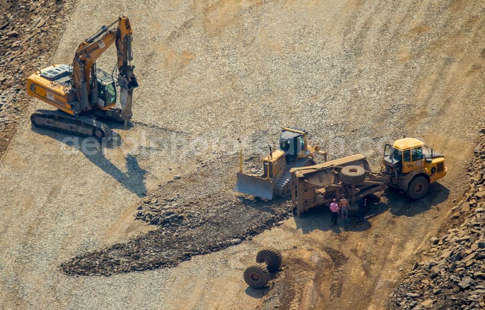 Aerial photograph Meschede - Construction machines at the construction site for the new building of routing and traffic lanes over the highway bridge in the motorway A46 in Meschede in the state North Rhine-Westphalia