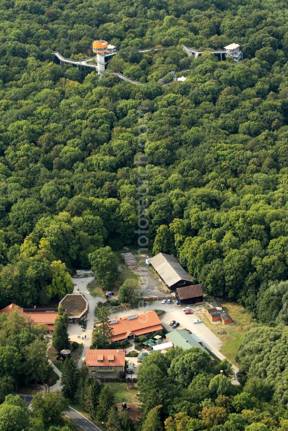 Aerial photograph Bad Langensalza - Tree - tower in the nature trail in Thuringia Hainich. This nature trail is located in the Forest of Bad Langensalza and the building is owned by the city. The project is operated by the Reko GmbH and costs 1.8 million euros. The path is 306 m long and 24.5 m height ends in visible light on the tree tower. The trail can be visited all year round