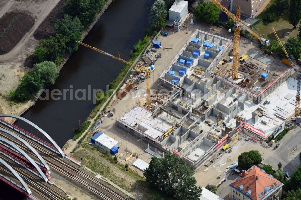 Berlin from the bird's eye view: Construction site of a care home for the elderly in the Baumschulenweg part of the district of Treptow-Köpernick in Berlin in the state of Brandenburg. The future care facility will provide living space for 200 inhabitants. The site is located at the Britzer Verbindungskanal (channel) and the newly built railway bridge. The name Baumschulenweg stems from the former nursery garden located here