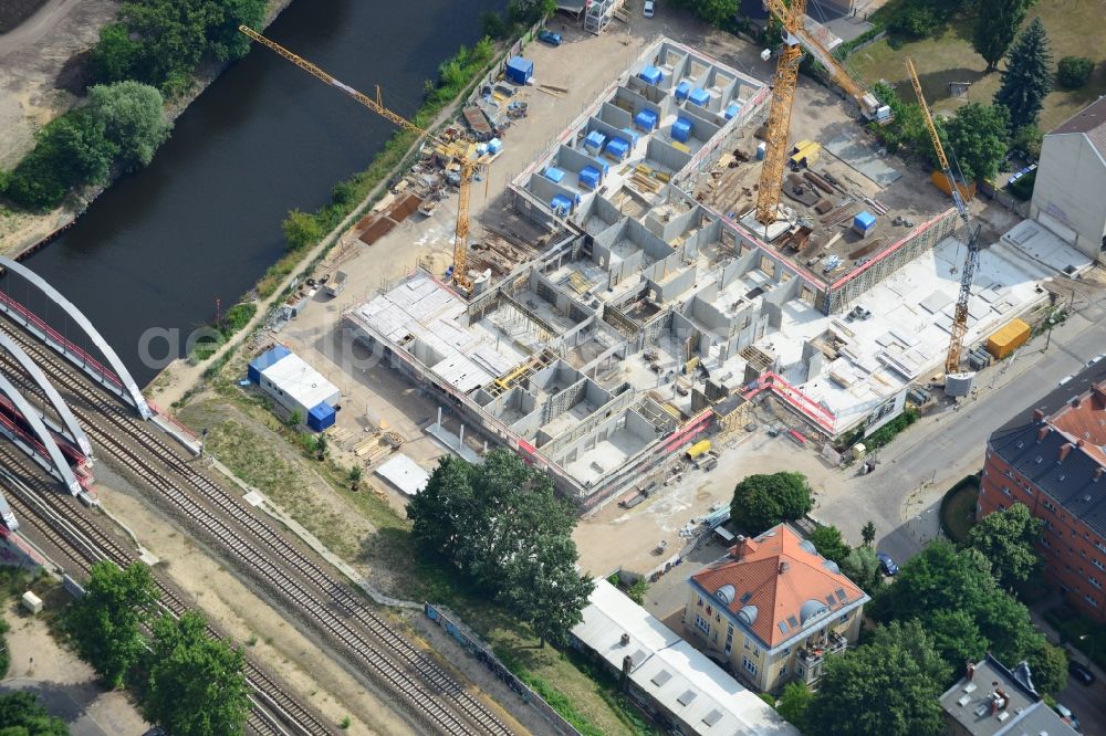 Aerial image Berlin - Construction site of a care home for the elderly in the Baumschulenweg part of the district of Treptow-Köpernick in Berlin in the state of Brandenburg. The future care facility will provide living space for 200 inhabitants. The site is located at the Britzer Verbindungskanal (channel) and the newly built railway bridge. The name Baumschulenweg stems from the former nursery garden located here