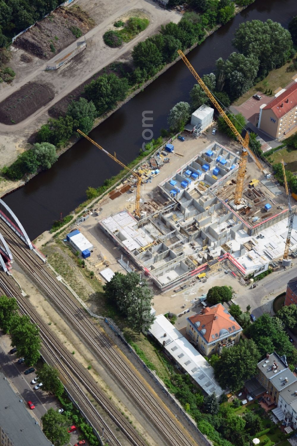 Aerial photograph Berlin - Construction site of a care home for the elderly in the Baumschulenweg part of the district of Treptow-Köpernick in Berlin in the state of Brandenburg. The future care facility will provide living space for 200 inhabitants. The site is located at the Britzer Verbindungskanal (channel) and the newly built railway bridge. The name Baumschulenweg stems from the former nursery garden located here