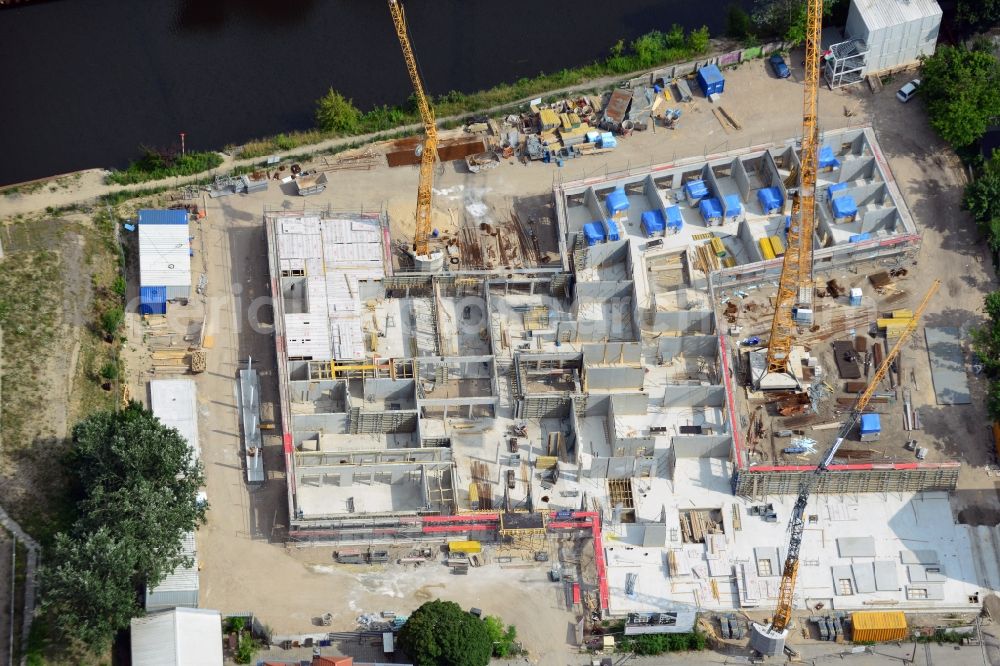 Berlin from the bird's eye view: Construction site of a care home for the elderly in the Baumschulenweg part of the district of Treptow-Köpernick in Berlin in the state of Brandenburg. The future care facility will provide living space for 200 inhabitants. The site is located at the Britzer Verbindungskanal (channel) and the newly built railway bridge. The name Baumschulenweg stems from the former nursery garden located here