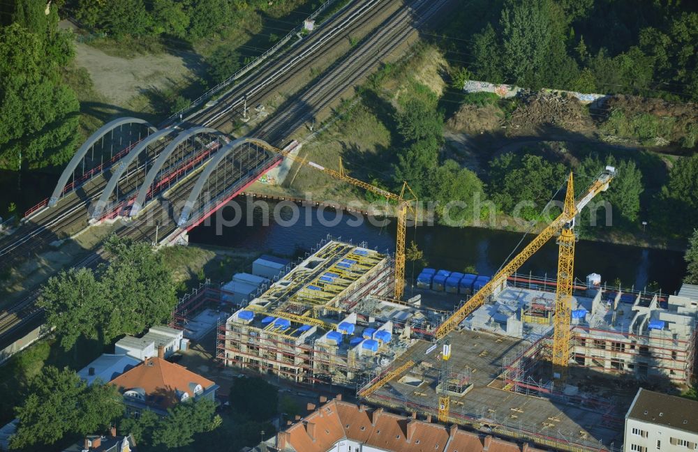 Aerial image Berlin - Construction site of a care home for the elderly in the Baumschulenweg part of the district of Treptow-Köpernick in Berlin in the state of Brandenburg. The future care facility will provide living space for 200 inhabitants. The site is located at the Britzer Verbindungskanal (channel) and the newly built railway bridge. The name Baumschulenweg stems from the former nursery garden located here