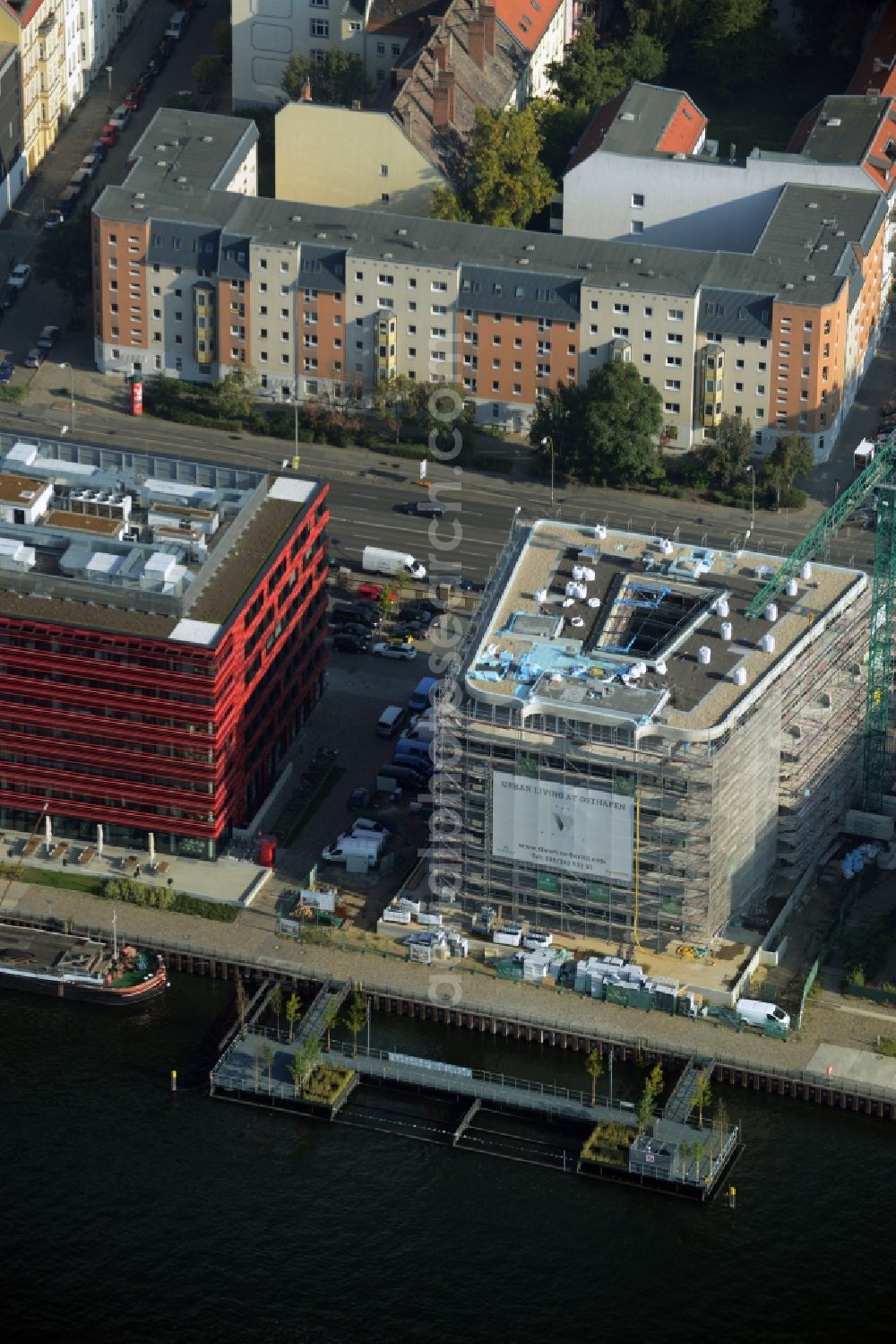 Berlin from above - Construction site of the new multi-family residential and apartment building complex The White on East harbour on the Northern shore of the Spree in Berlin in Germany