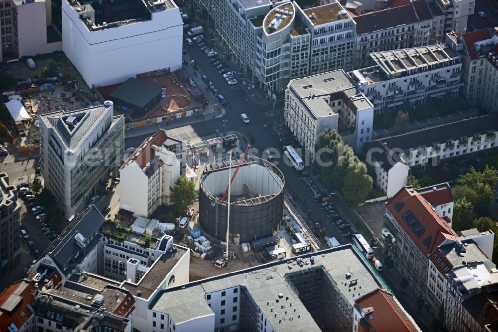 Aerial photograph Berlin - View at the construction site of the new building Asisi-Panometer at the Friedrichstrasse in the district Mitte in Berlin. The Panometer is a project of the artist Yadegar Asisi and shows a panoramic view through an compressed artistic look at his panoramic image The Wall about the divided Berlin during the Cold War. Responsible for the architecture is the architect office Behzadi + Partner Architekten BDA established in Leipzig 