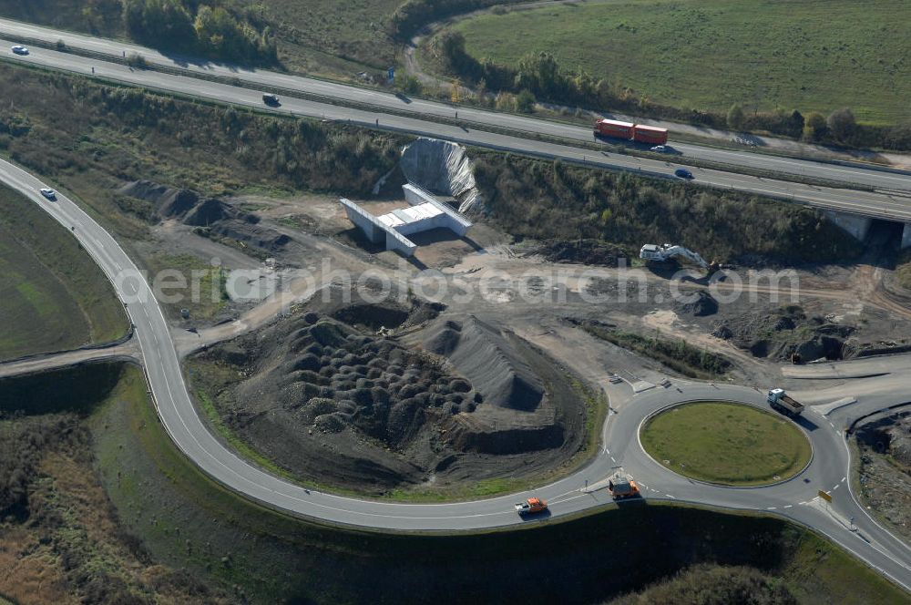 Aerial photograph Eisenach - Blick auf die Baustelle der Ausfahrt / Anschlussstelle Eisenach-West der A4. Hier eine Unterführung im Südteil mit Kreisverkehr. Der Neubau ist Teil des Projekt Nordverlegung / Umfahrung Hörselberge der Autobahn E40 / A4 in Thüringen bei Eisenach. Durchgeführt werden die im Zuge dieses Projektes notwendigen Arbeiten unter an derem von den Mitarbeitern der Niederlassung Weimar der EUROVIA Verkehrsbau Union sowie der Niederlassungen Abbruch und Erdbau, Betonstraßenbau, Ingenieurbau und TECO Schallschutz der EUROVIA Beton sowie der DEGES.