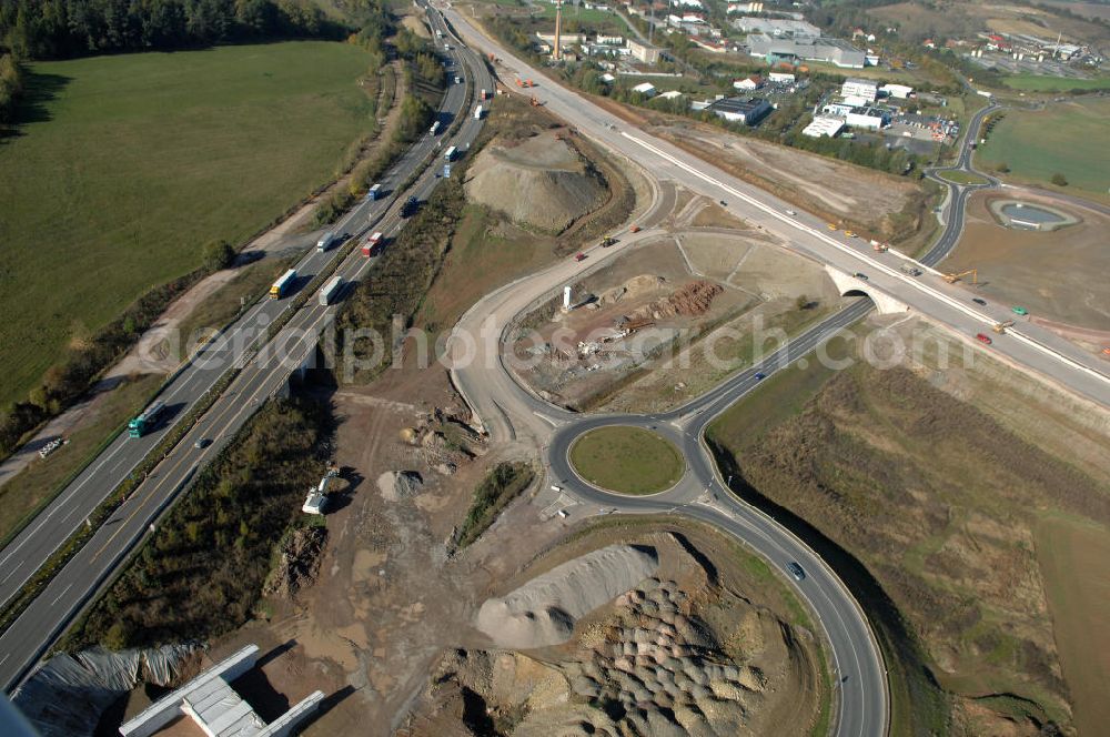 Aerial photograph Eisenach - Blick auf die Baustelle der Ausfahrt / Anschlussstelle Eisenach-West der A4. Hier eine Unterführung im Südteil mit Kreisverkehr. Der Neubau ist Teil des Projekt Nordverlegung / Umfahrung Hörselberge der Autobahn E40 / A4 in Thüringen bei Eisenach. Durchgeführt werden die im Zuge dieses Projektes notwendigen Arbeiten unter an derem von den Mitarbeitern der Niederlassung Weimar der EUROVIA Verkehrsbau Union sowie der Niederlassungen Abbruch und Erdbau, Betonstraßenbau, Ingenieurbau und TECO Schallschutz der EUROVIA Beton sowie der DEGES.