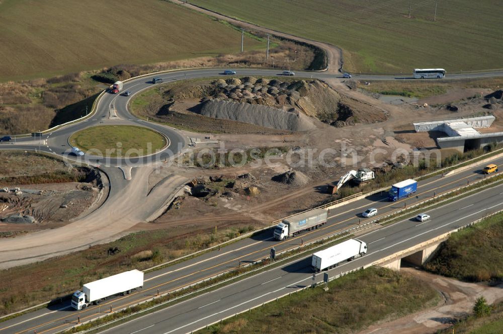 Aerial photograph Eisenach - Blick auf die Baustelle der Ausfahrt / Anschlussstelle Eisenach-West der A4. Hier eine Unterführung im Südteil mit Kreisverkehr. Der Neubau ist Teil des Projekt Nordverlegung / Umfahrung Hörselberge der Autobahn E40 / A4 in Thüringen bei Eisenach. Durchgeführt werden die im Zuge dieses Projektes notwendigen Arbeiten unter an derem von den Mitarbeitern der Niederlassung Weimar der EUROVIA Verkehrsbau Union sowie der Niederlassungen Abbruch und Erdbau, Betonstraßenbau, Ingenieurbau und TECO Schallschutz der EUROVIA Beton sowie der DEGES.