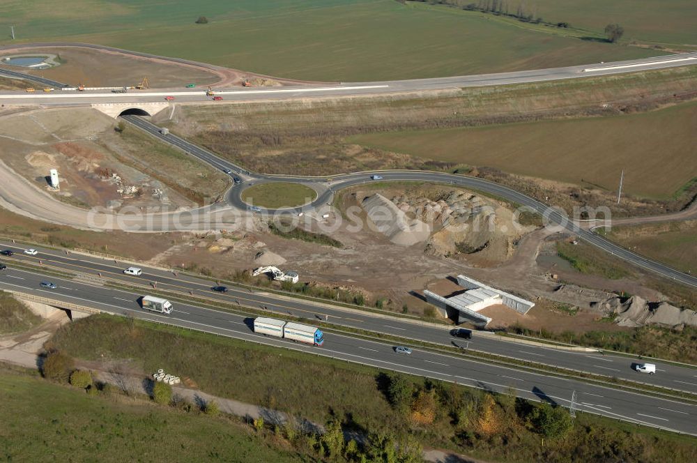 Eisenach from the bird's eye view: Blick auf die Baustelle der Ausfahrt / Anschlussstelle Eisenach-West der A4. Hier eine Unterführung im Südteil mit Kreisverkehr. Der Neubau ist Teil des Projekt Nordverlegung / Umfahrung Hörselberge der Autobahn E40 / A4 in Thüringen bei Eisenach. Durchgeführt werden die im Zuge dieses Projektes notwendigen Arbeiten unter an derem von den Mitarbeitern der Niederlassung Weimar der EUROVIA Verkehrsbau Union sowie der Niederlassungen Abbruch und Erdbau, Betonstraßenbau, Ingenieurbau und TECO Schallschutz der EUROVIA Beton sowie der DEGES.