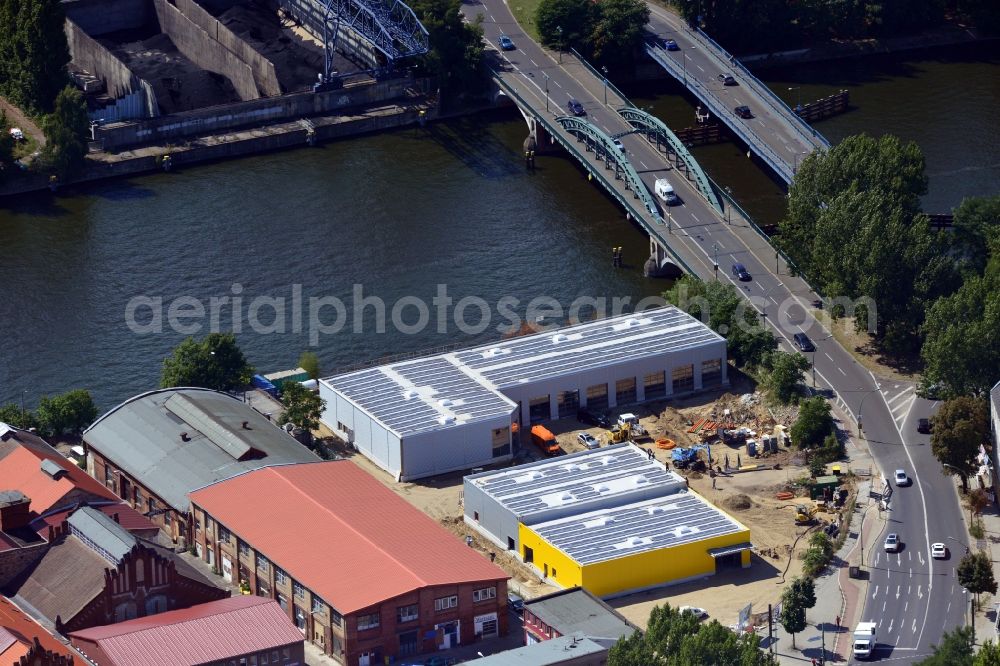 Berlin from above - Construction site of the company Auto plus AG workshop in the Siemens strasse on the banks of the River Spree in Berlin Schoeneweide