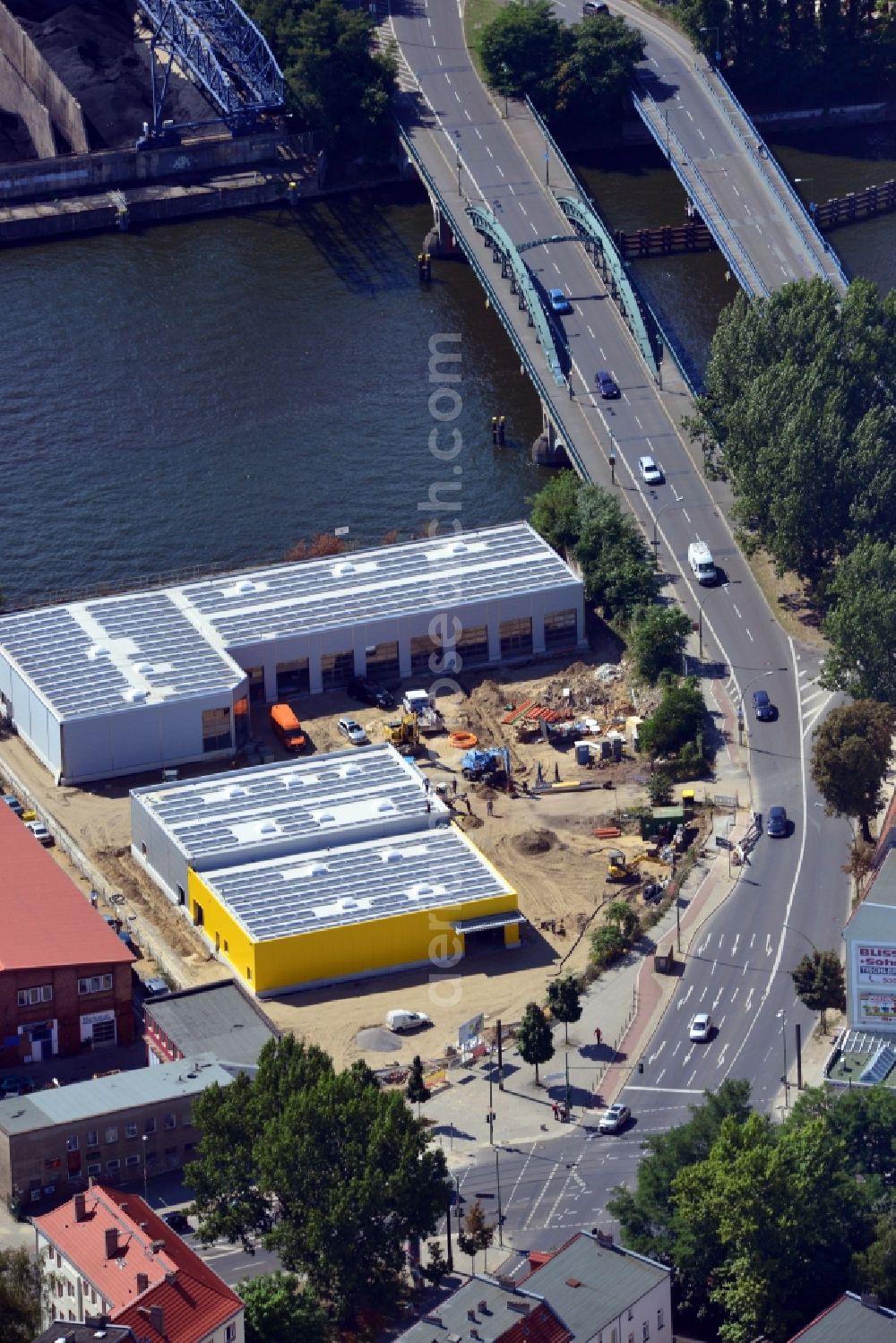 Berlin from the bird's eye view: Construction site of the company Auto plus AG workshop in the Siemens strasse on the banks of the River Spree in Berlin Schoeneweide