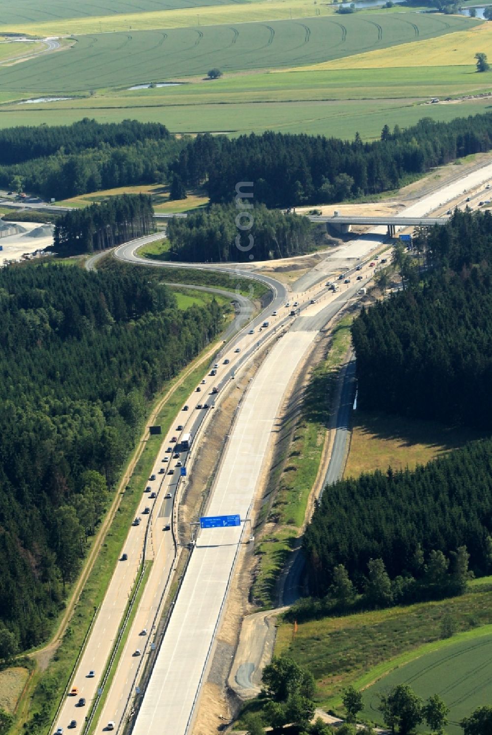 Dittersdorf from the bird's eye view: In connection with the three-track expansion of federal motorway A9 construction took place in Thuringia at the motorway exit Dittersdorf. To secure the site of the traffic was diverted. Under the bridge, the newly constructed roads meet