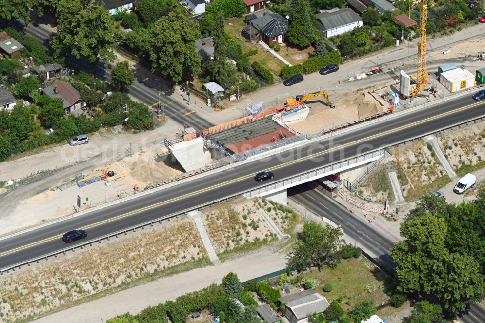 Aerial image Berlin - Construction site for the new building of Routing and traffic lanes over the highway bridge in the motorway A 114 about the Bahnhofstrasse in Berlin Blankenburg in Berlin, Germany