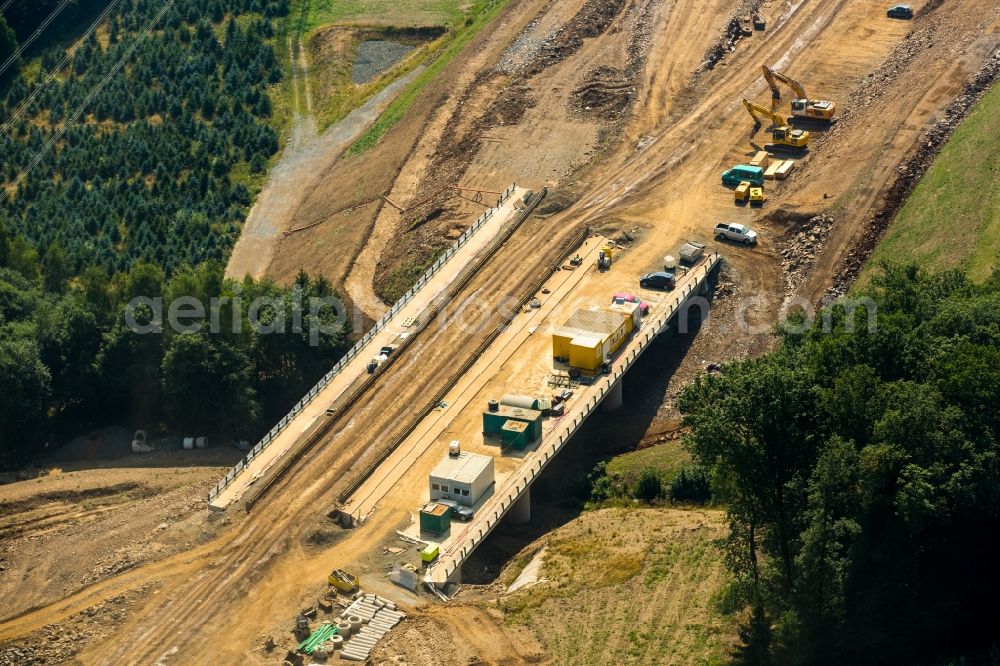 Aerial photograph Meschede - Construction site for the new building of Routing and traffic lanes over the highway bridge in the motorway A46 in Meschede in Sauerland in the state North Rhine-Westphalia